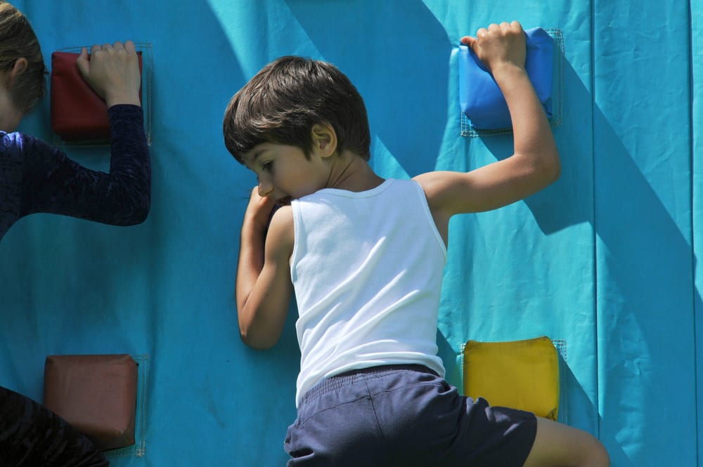 A child enjoying the climbing wall