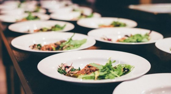 Dinner dishes being lined up to be served at The Alex Hotel