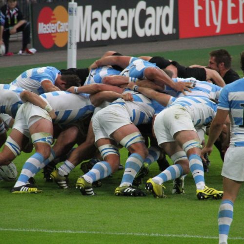 Players playing a rugby match