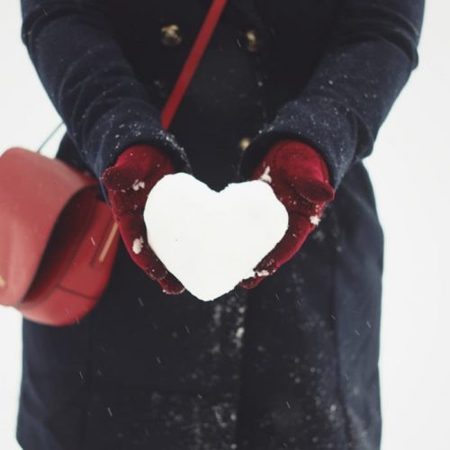 A women enjoying the snow outside The Alex Hotel