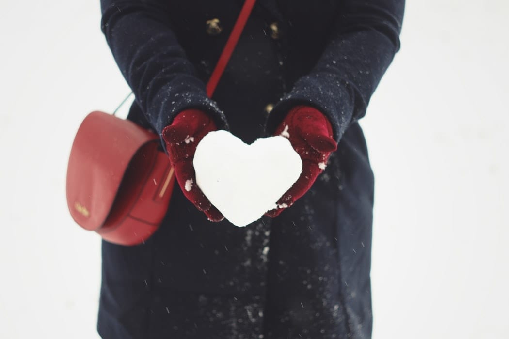 A women enjoying the snow outside The Alex Hotel