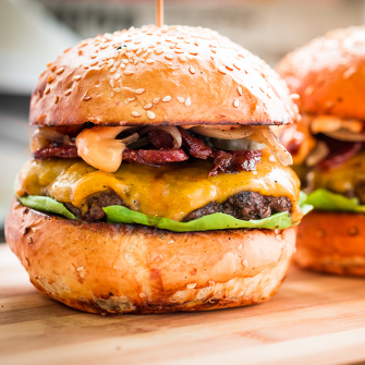 Freshly flame grilled bacon cheese burger at The Alex Hotel